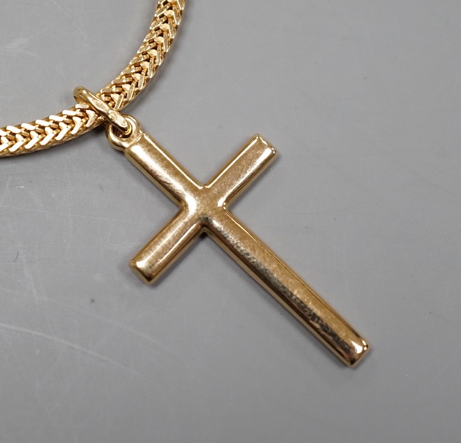 A modern Italian 750 yellow metal cross pendant, 32mm, on an Italian 750 chain, 66cm, 27.4 grams.